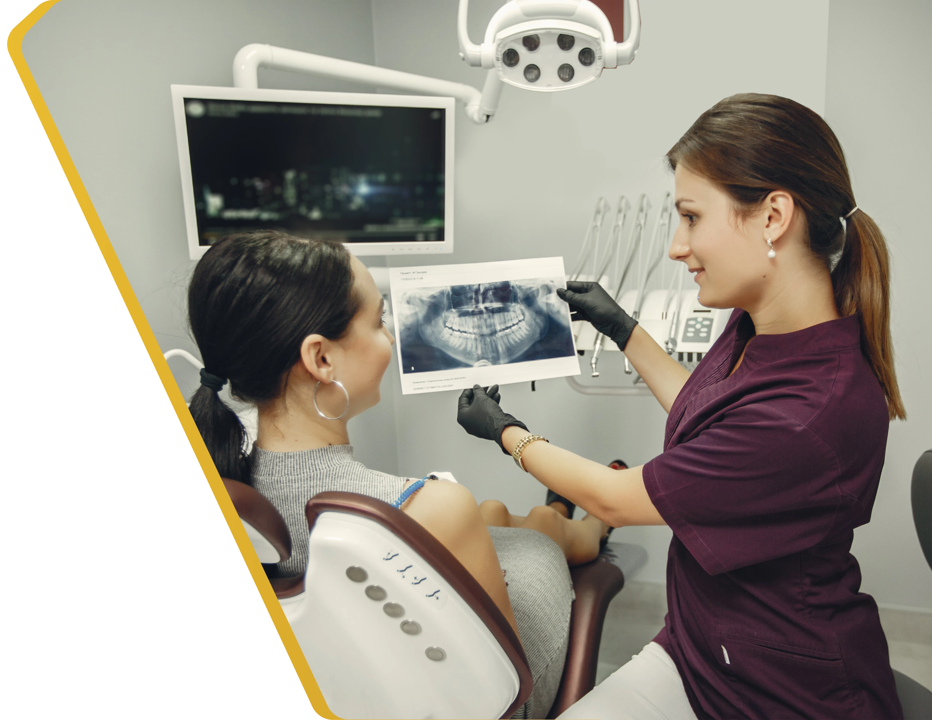 A dentist reviewing digital dental X-rays on screen at Dentistry at Millennium Park in Chicago