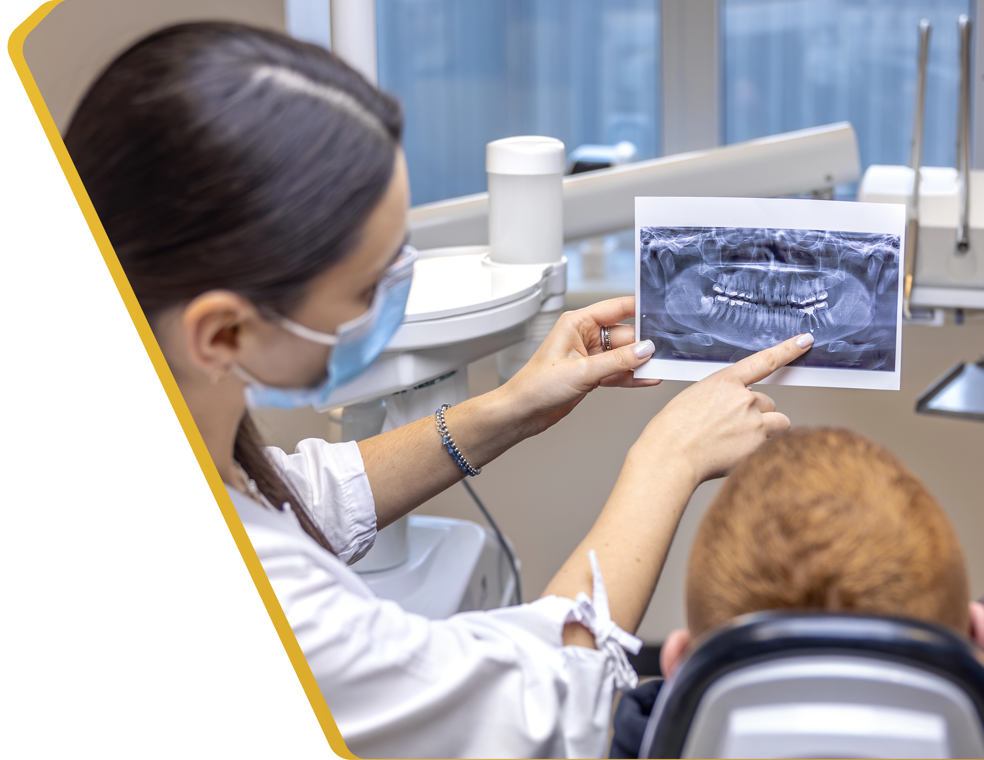 A child receiving gentle, low-radiation dental X-rays at Dentistry at Millennium Park in Chicago