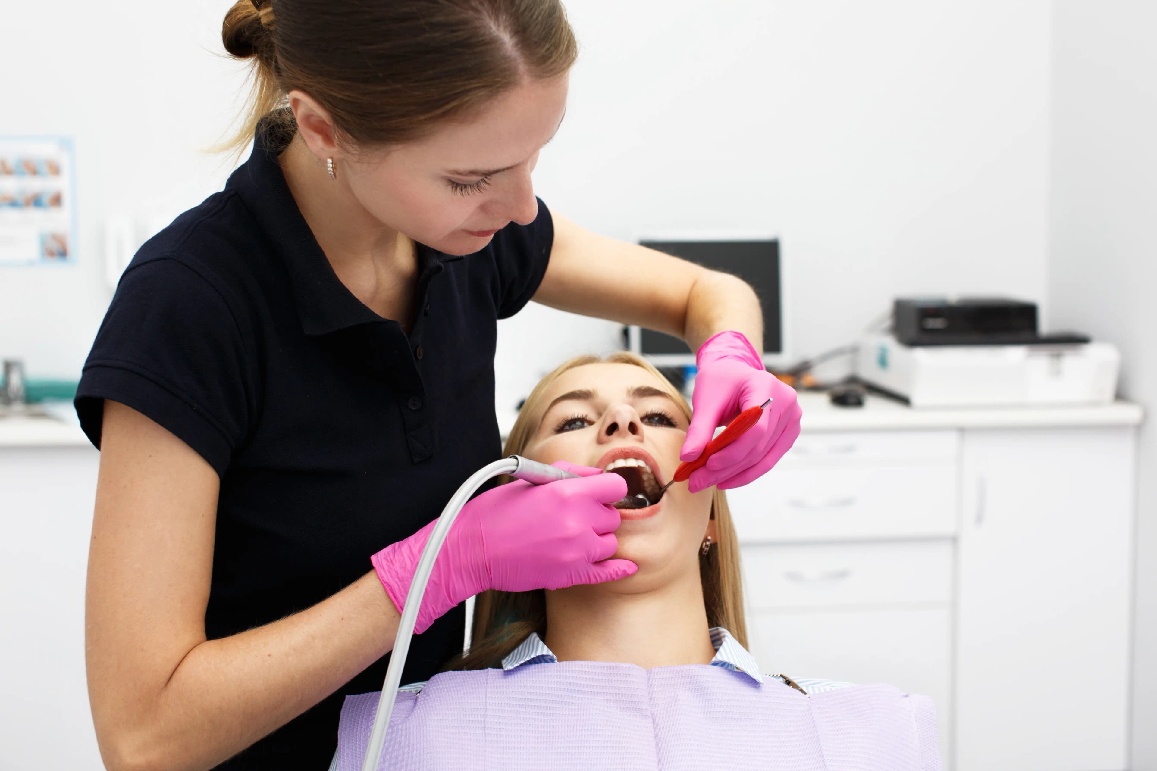 A patient receiving a gentle dental exam and cleaning at Dentistry at Millennium Park in Chicago