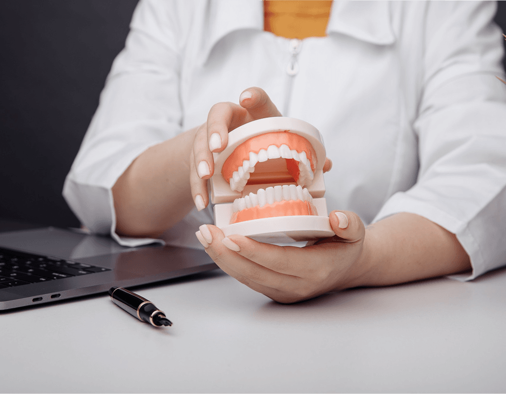 A patient's confident smile after full or partial dentures at Dentistry at Millennium Park in Chicago