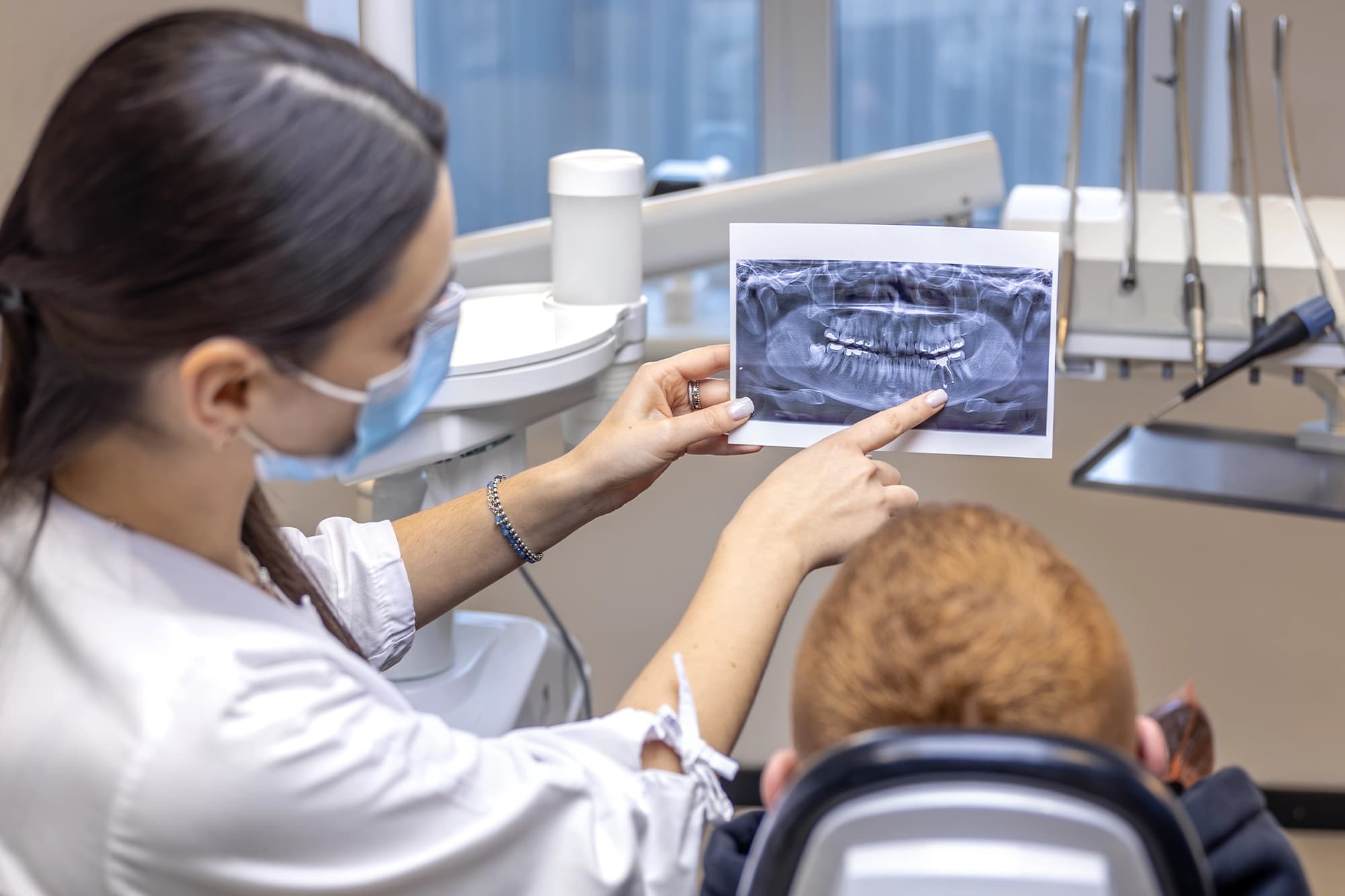 A child receiving gentle, low-radiation dental X-rays at Dentistry at Millennium Park in Chicago