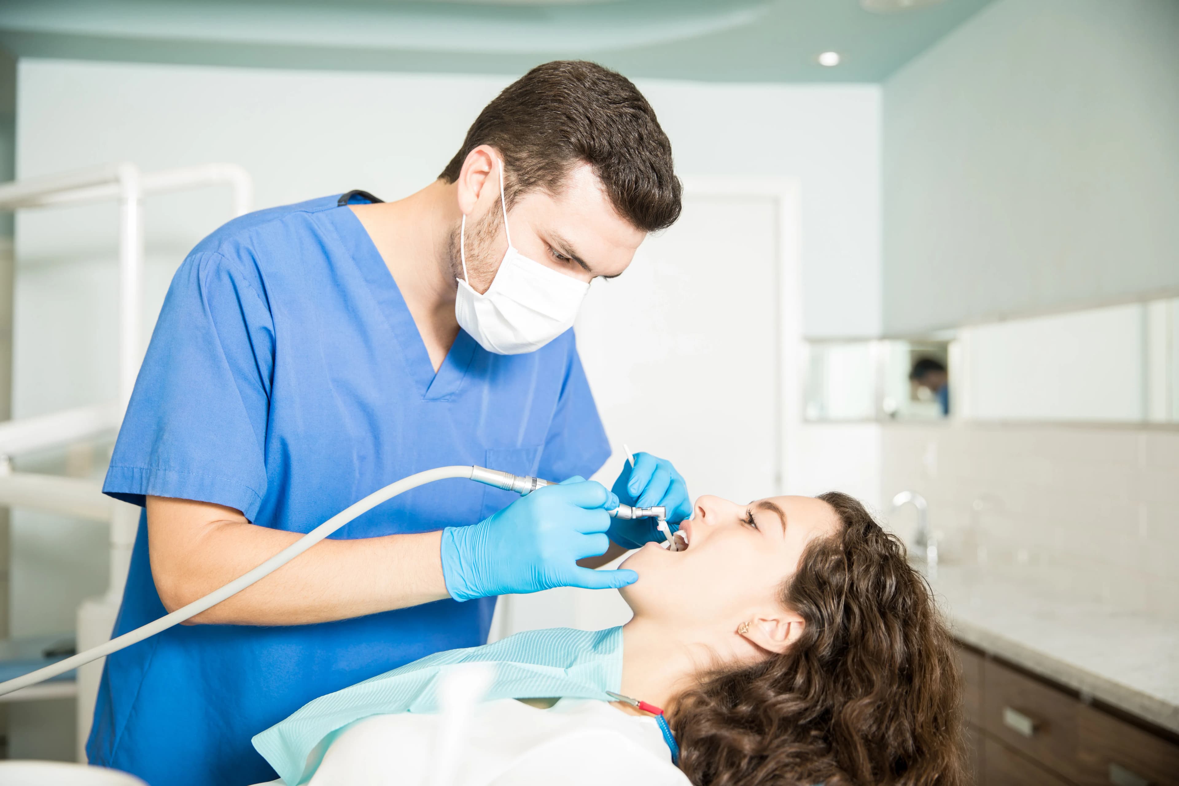 A patient receiving gentle gum disease treatment at Dentistry at Millennium Park in Chicago