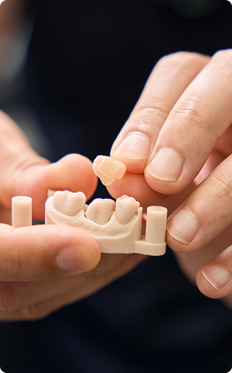 A tooth-colored porcelain dental crown