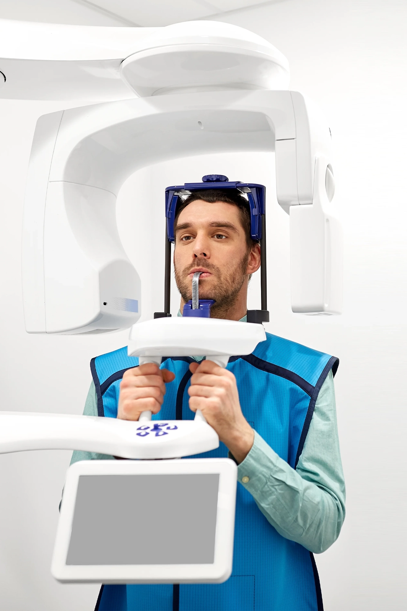 A handheld intraoral scanner capturing a 3D digital scan of a patient's teeth
