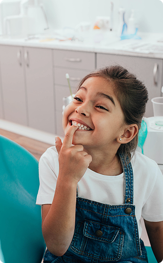 A protective fluoride varnish being applied to a child's teeth