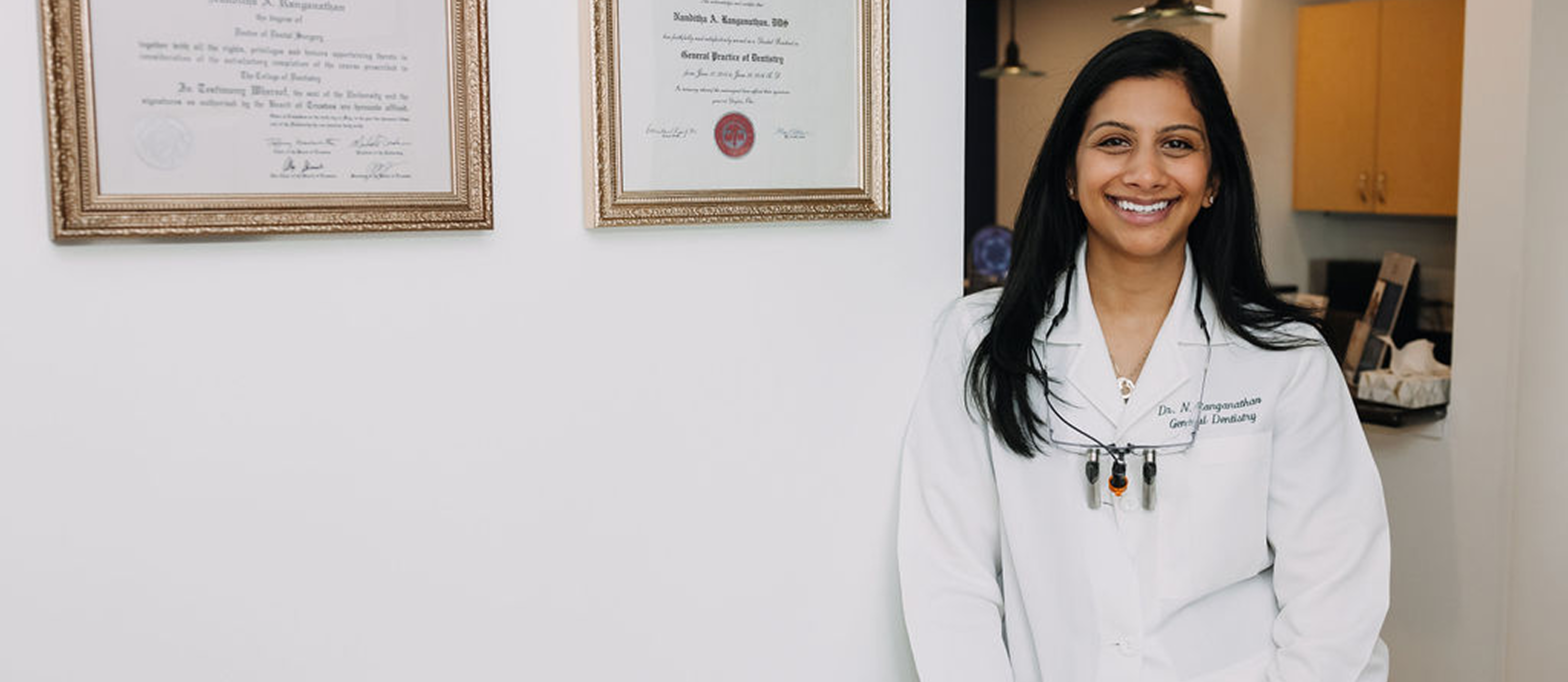 Dr. Nanditha A. Ranganathan, DDS, founder of Dentistry at Millennium Park, with her credentials displayed