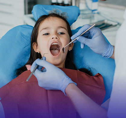 A child receiving a gentle dental cleaning