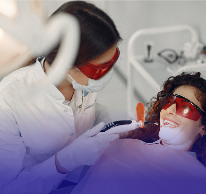 An intraoral camera showing a patient their teeth